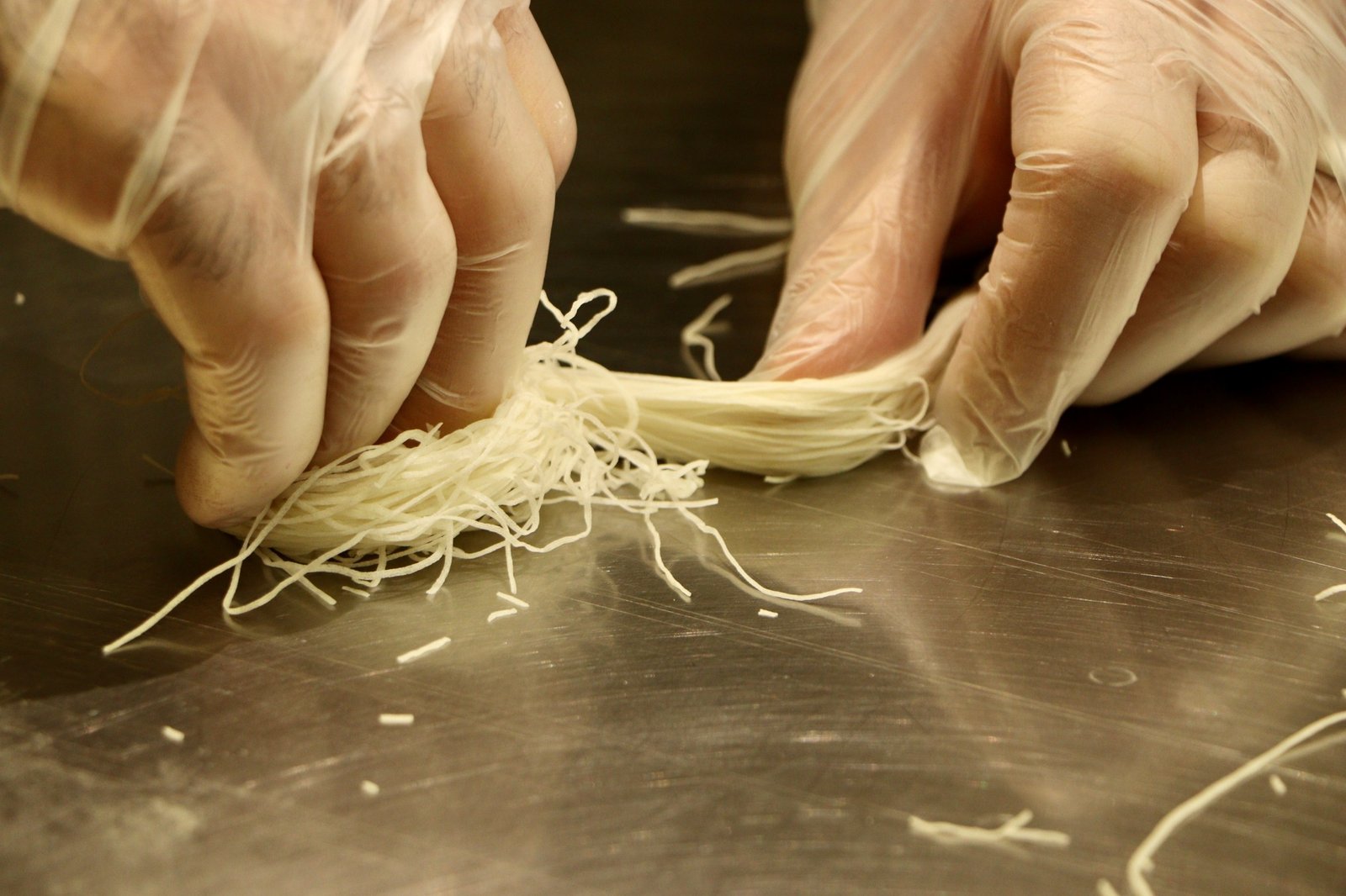 Handcrafting fine pastry strands by hand at Pâtisserie Alsham